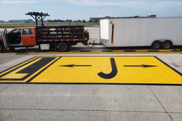 Roadway with fresh thermoplastic markings applied by McShea Contracting’s specialized crew